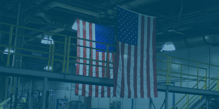 American flags hanging above factory floor